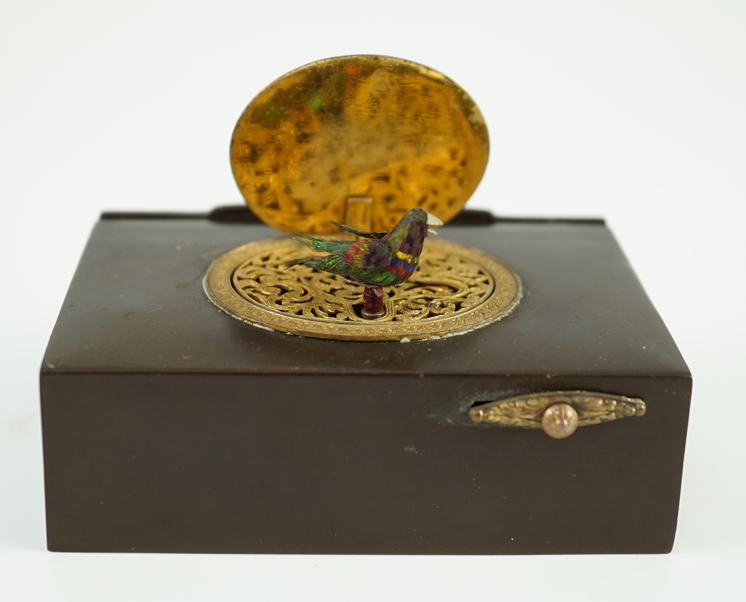 A late 19th century Swiss gilt metal mounted phenolic singing bird box, 10 x 7cm, 3cm high